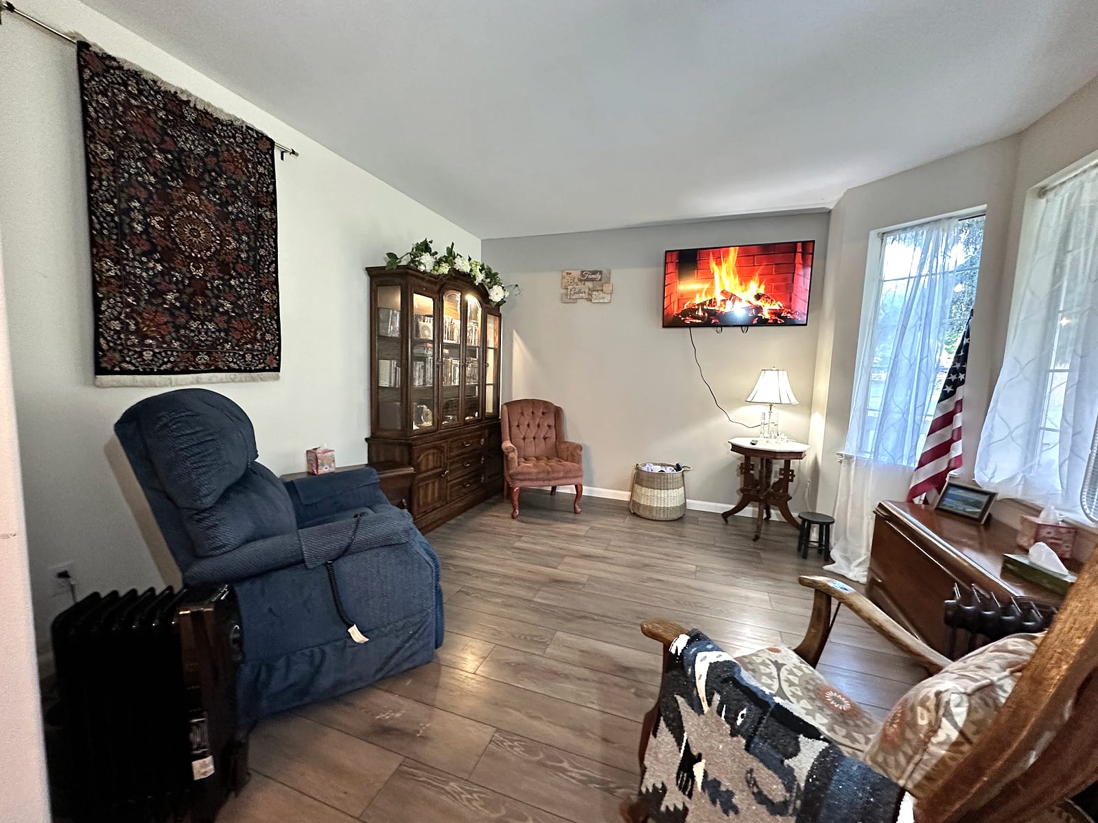 Living room with leather sofa and fireplace.